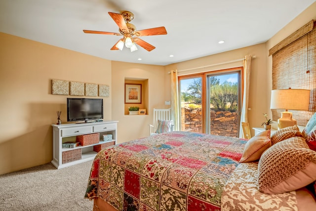 bedroom featuring ceiling fan, access to exterior, and carpet