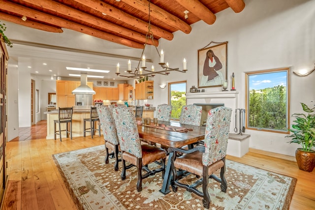 tiled dining area with beam ceiling, wood ceiling, and a chandelier