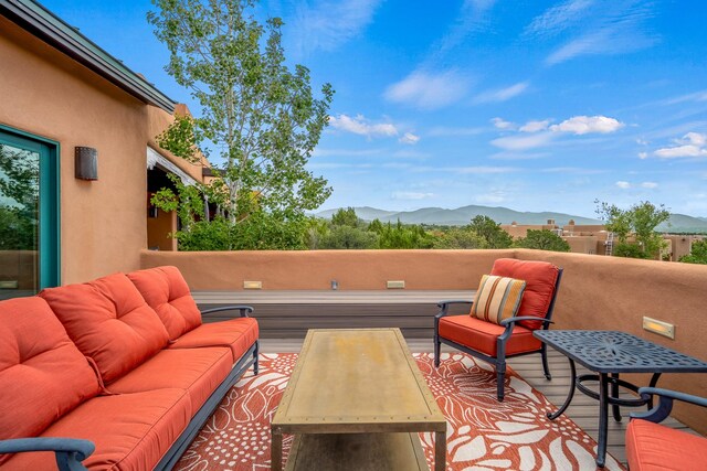 view of patio / terrace featuring a mountain view and an outdoor living space