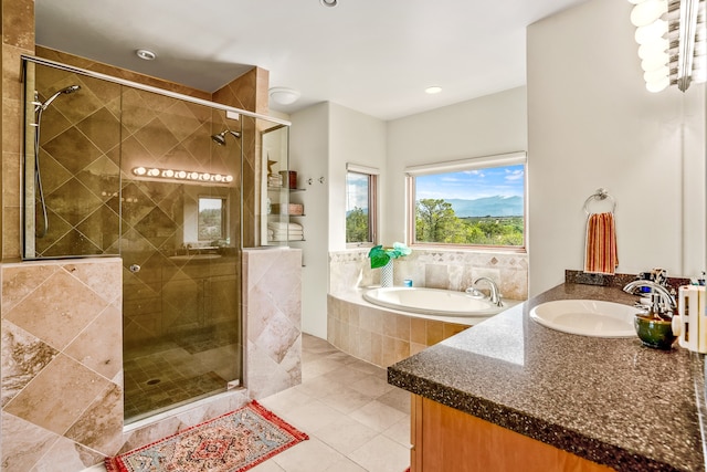 bathroom featuring tile patterned floors, vanity, and independent shower and bath