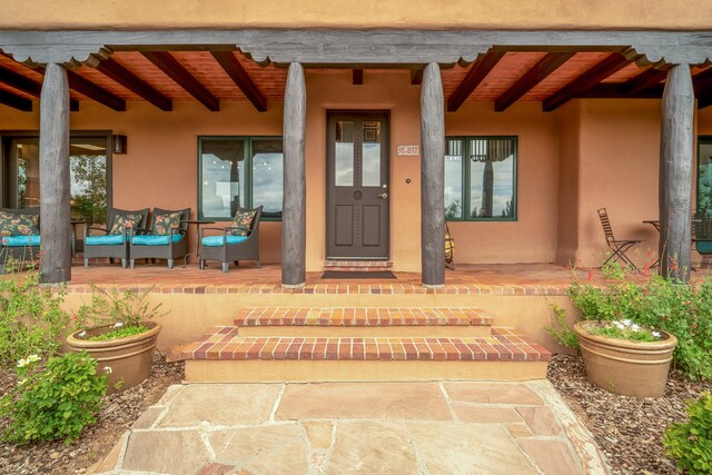 doorway to property with a patio area