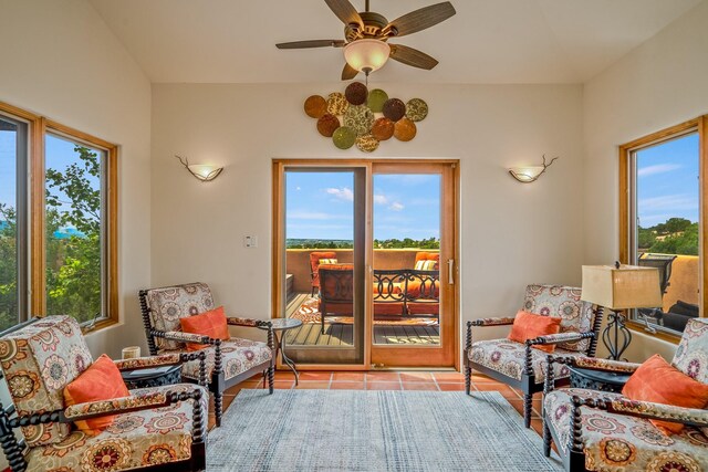 tiled living room with ceiling fan