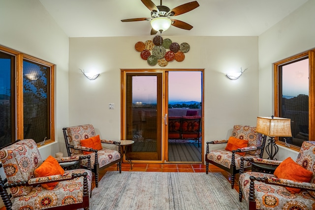 tiled living room featuring ceiling fan