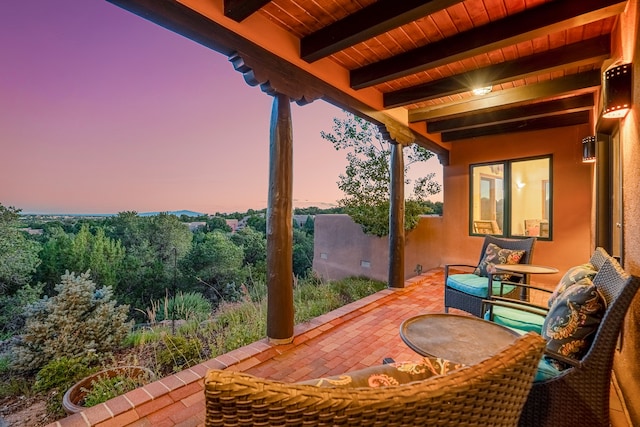 view of patio terrace at dusk