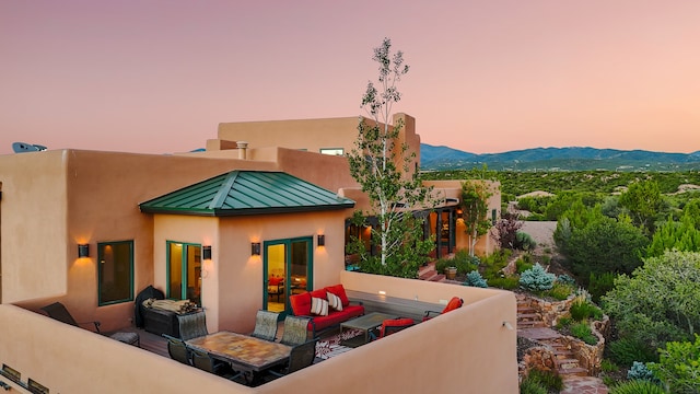 exterior space with outdoor lounge area and a mountain view