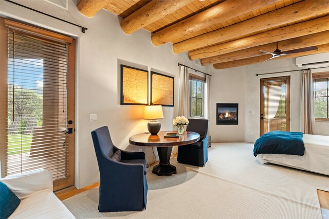 carpeted bedroom with beamed ceiling, a wall mounted air conditioner, and wood ceiling