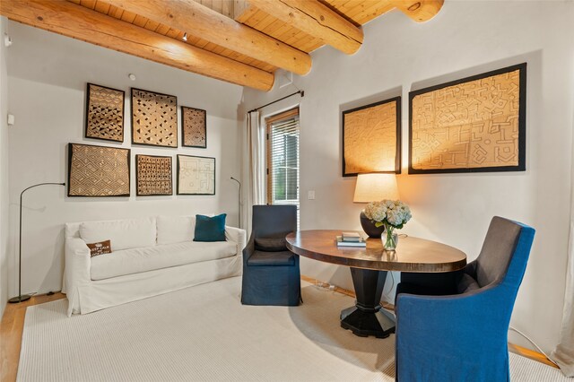 interior space featuring beamed ceiling and wood ceiling