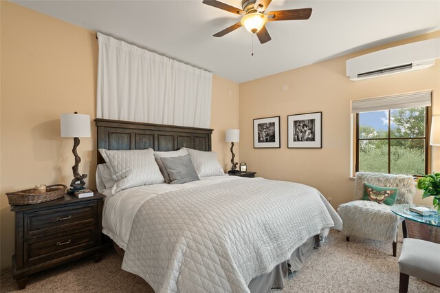 bedroom with ceiling fan, an AC wall unit, and dark colored carpet