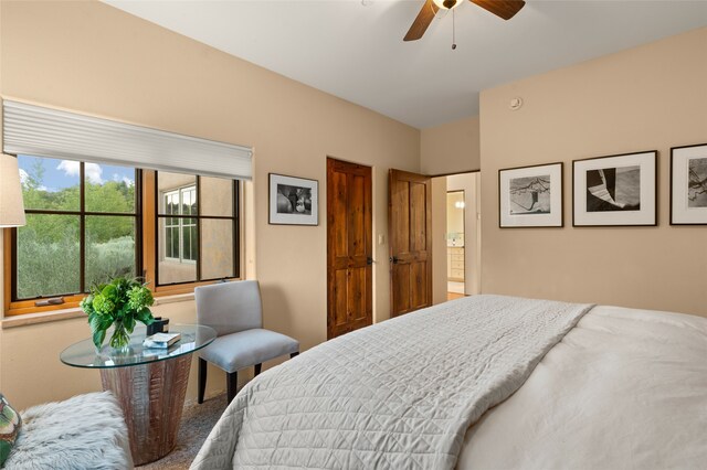 carpeted bedroom featuring ceiling fan