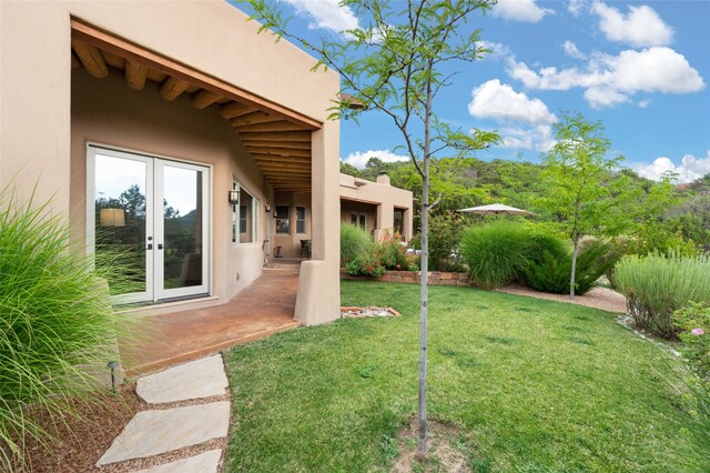 view of yard with french doors