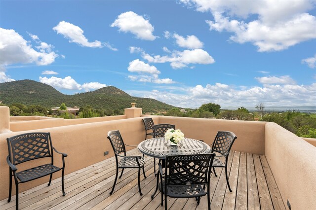 wooden deck featuring a mountain view