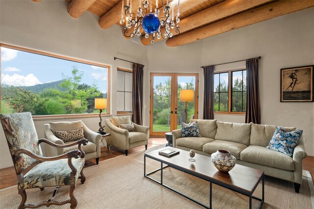 living room with wooden ceiling, french doors, a notable chandelier, beam ceiling, and wood-type flooring