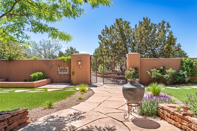 view of patio with fence private yard and a gate