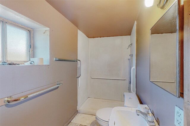 bathroom with toilet, tile patterned floors, sink, and a shower