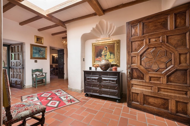 sitting room with beamed ceiling