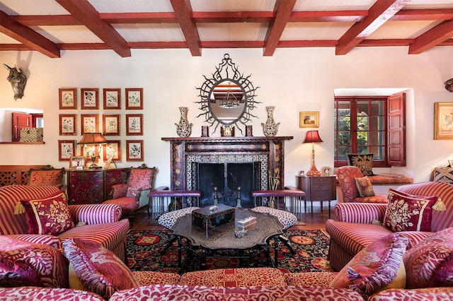 living room with beam ceiling, hardwood / wood-style flooring, and a fireplace