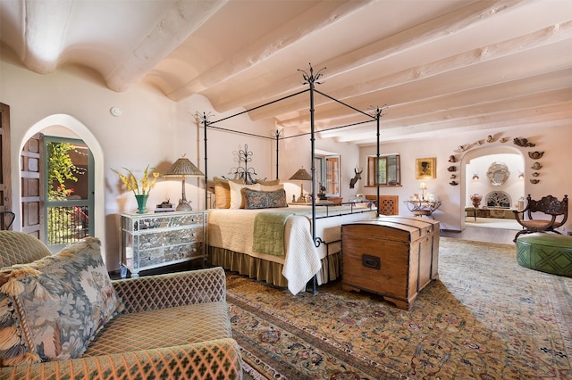 bedroom featuring beam ceiling