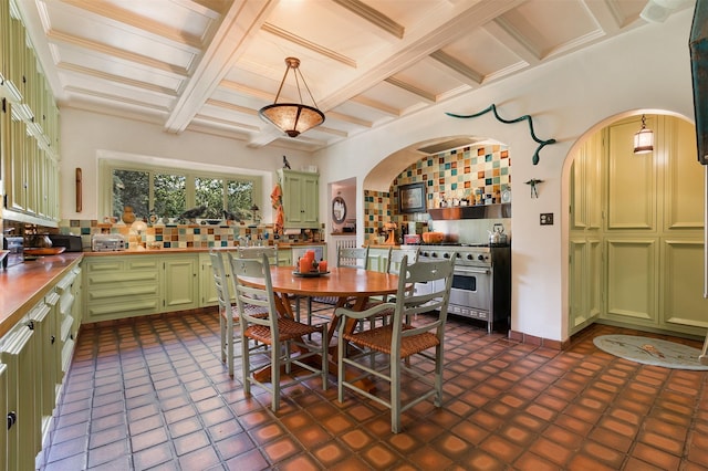 dining space featuring coffered ceiling and beam ceiling