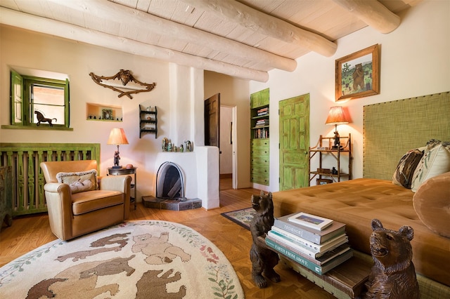 sitting room with wood ceiling and beamed ceiling