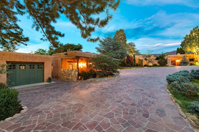 southwest-style home with a garage