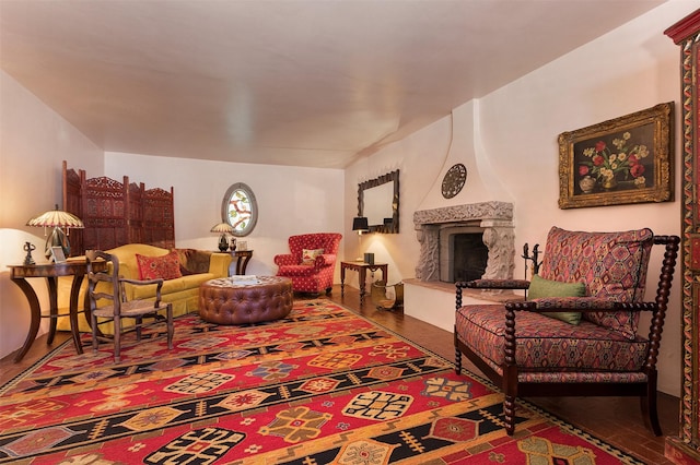 living room featuring a large fireplace