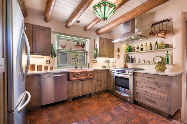 kitchen featuring pendant lighting, island range hood, beamed ceiling, sink, and stainless steel appliances