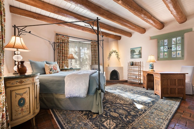 bedroom featuring multiple windows, wood ceiling, and beamed ceiling