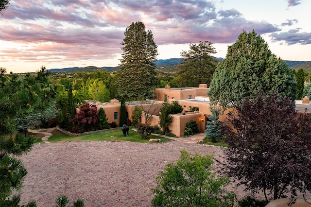 yard at dusk with a mountain view