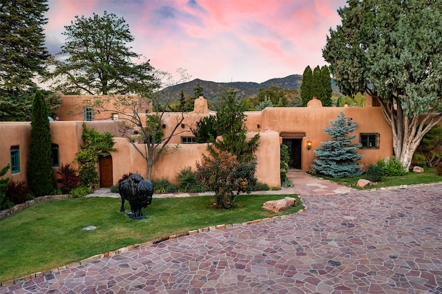 pueblo-style house with a mountain view