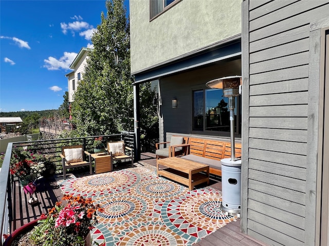 view of patio / terrace featuring an outdoor hangout area and a balcony