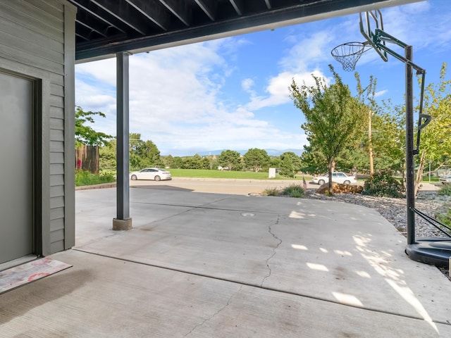 view of patio / terrace with basketball hoop