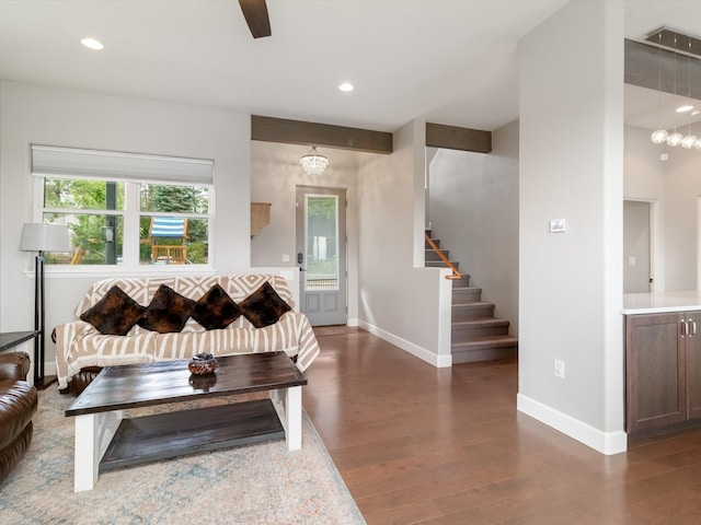 living room with a notable chandelier and wood-type flooring