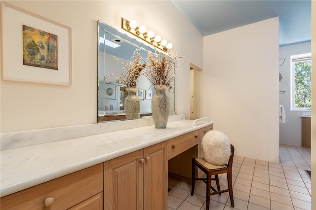 bathroom with tile patterned floors and vanity