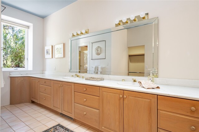 bathroom featuring vanity, tile patterned floors, and walk in shower