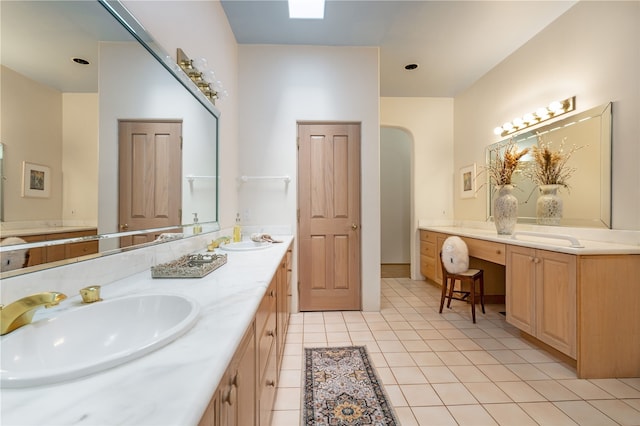 bathroom with tile patterned floors and vanity