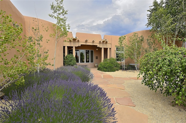 rear view of property featuring a patio