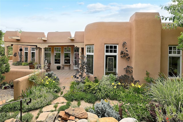 back of house featuring a patio area