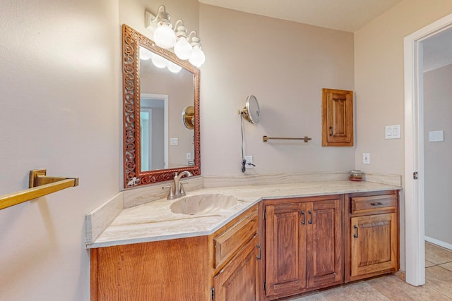 bathroom featuring tile patterned flooring and vanity