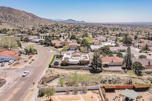 birds eye view of property with a mountain view