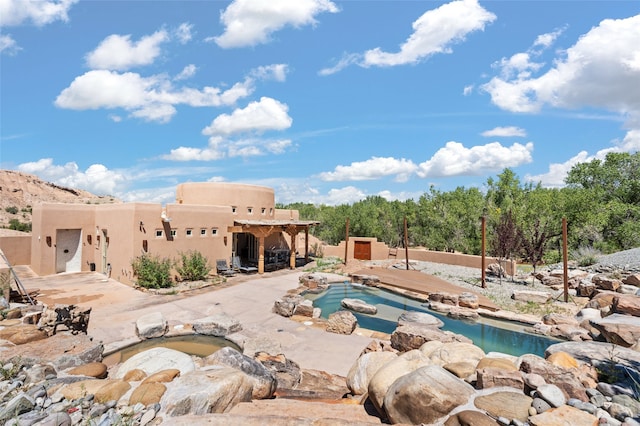 view of pool featuring a patio area