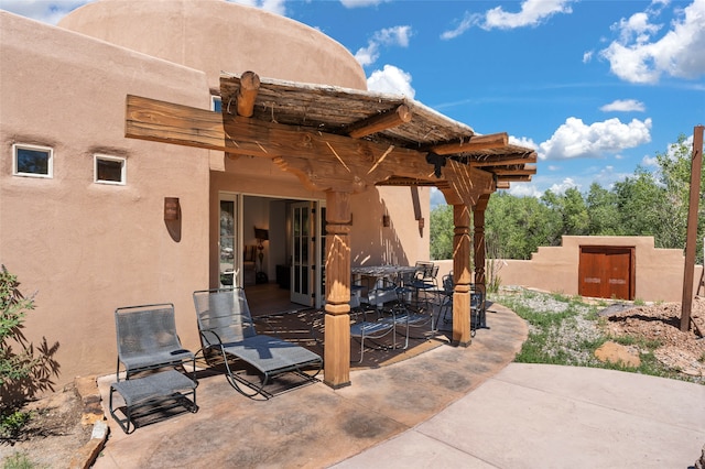 view of patio featuring a pergola