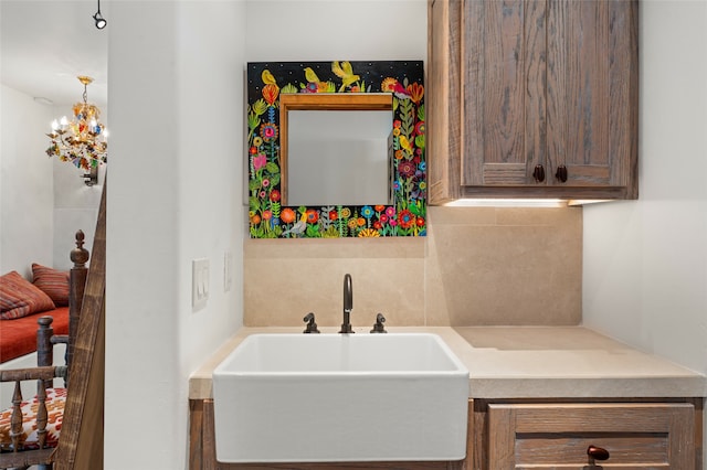 interior space featuring sink and a chandelier