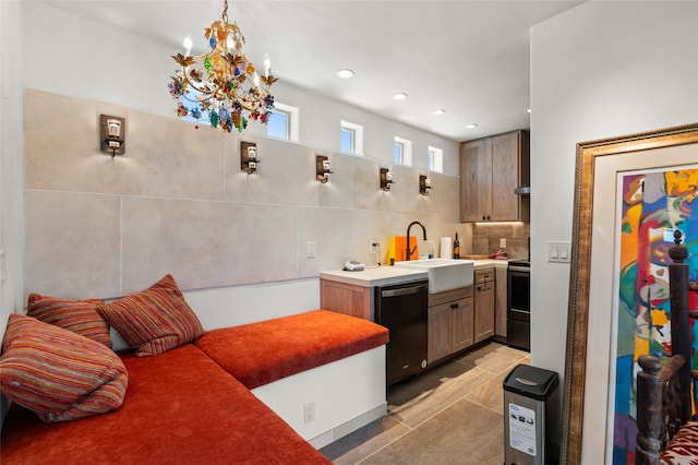 kitchen with decorative backsplash, stainless steel range with electric cooktop, sink, light tile patterned floors, and black dishwasher