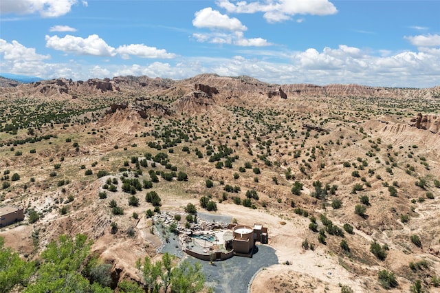 birds eye view of property featuring a mountain view