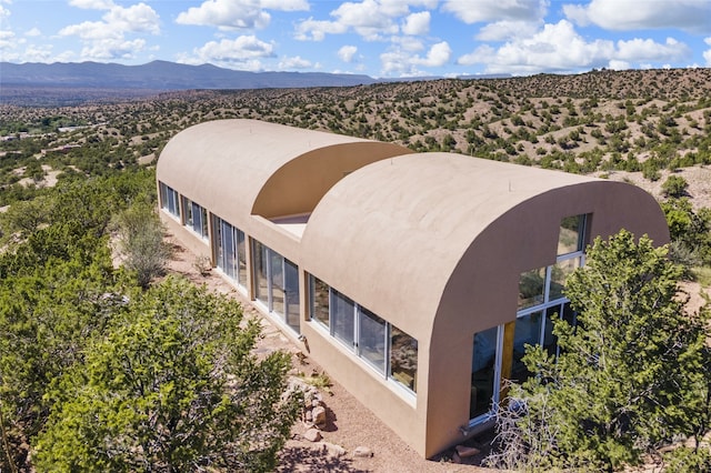 birds eye view of property with a mountain view