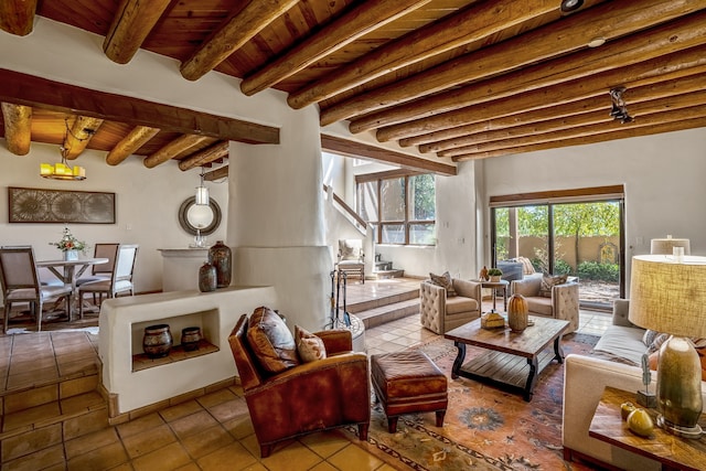 living room with tile patterned floors, beam ceiling, and wooden ceiling