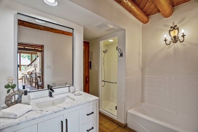 bathroom with tile patterned flooring, vanity, and a shower with shower door