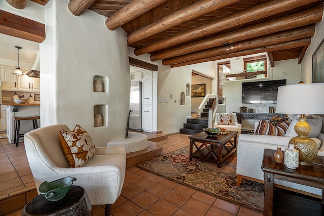 tiled living room with beamed ceiling and wooden ceiling