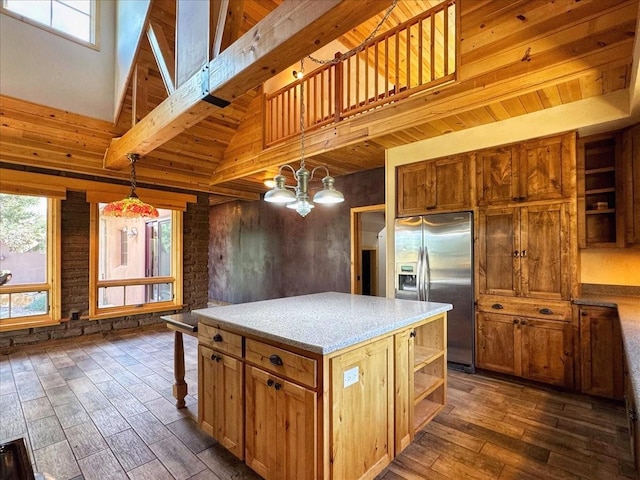 125 Tierra Del Dios, Rowe, NM 87562 - kitchen featuring dark wood finished floors, an inviting chandelier, open shelves, light countertops, and stainless steel fridge