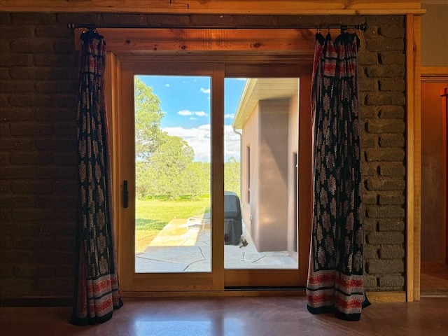 125 Tierra Del Dios, Rowe, NM 87562 - doorway to outside with brick wall
